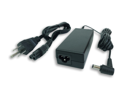 Adapter ac/dc power charger with wire of laptop computer isolated on white backgroundの写真素材