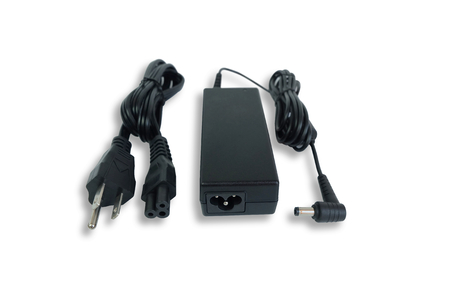 Adapter ac/dc power charger with wire of laptop computer isolated on white backgroundの写真素材
