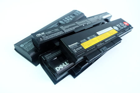 BANGKOK, THAILAND - August 1, 2018 Pile of used Laptop computer Battery or Notebook Battery Many brands ASUS,Lenovo,Dell,HP isolated on white backgroundのeditorial素材