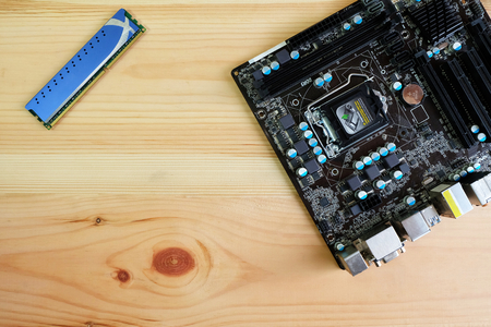 Computer Hardware, Hard drive SATA, Ram ddr and Motherboard on Wooden Floor,Top view