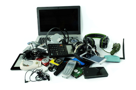 Pile of electronic waste, gadgets for daily use isolated on white background, Reuse and Recycle...