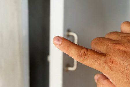 Her fingers were bleeding because of the door clamp, Blood hematoma nailsの写真素材