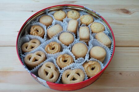 Many butter cookies in a round red box.の写真素材