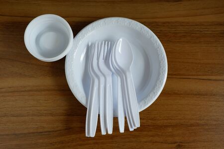 Disposable plastic products plates and spoons and plastic cups, Food container that is harmful to the environment.の写真素材