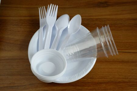 Disposable plastic products plates and spoons and plastic cups, Food container that is harmful to the environment.の写真素材