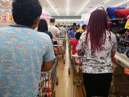 Bangkok, Thailand - October 10, 2019 : Many people are shopping in supermarkets push the shopping cart, line up in the queue to shop in the mall.のeditorial素材