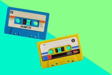 Old colorful cassette tape on wooden floor and leave blank space above for text inputの写真素材