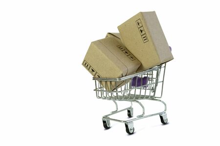 Shopping cart with Parcel box Products isolate on white background. Online shopping from home and delivery service business with copy space.の写真素材