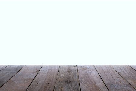 Old wooden table and empty front and white background, Empty space place a product,  texture with natural wood pattern for designの写真素材