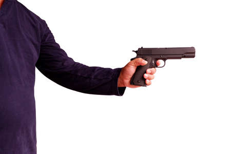 Man holding a gun in his hand and aiming isolated on whiteの写真素材