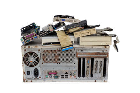 Pile of electronic waste, Rusty old computer cases and obsolete computer hardware such as motherboards and CD-ROMs, floppy disk isolated on white backgroundの写真素材