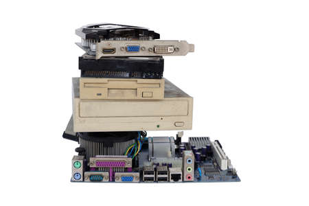 Electronic waste piles of rusty old and obsolete computer hardware such as motherboards, electronic circuit boards and CD-ROMs, floppy disks isolated on white background.の写真素材