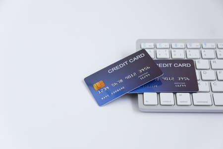 Credit card on computer keyboard on white desk. with copy space for text. Concept of Online shopping and payment.の写真素材