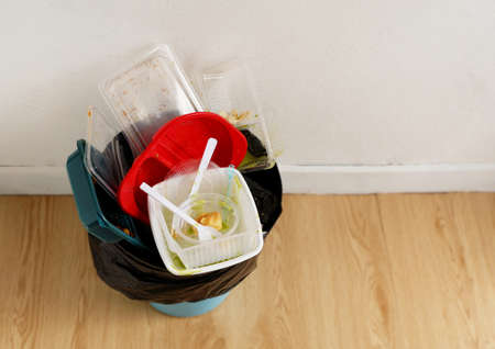 Disposable plastic food containers in the trash, Household plastic waste problem, recycleの写真素材