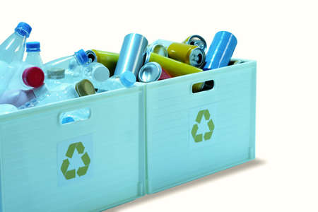 Waste plastic drinking water bottles and cans in trash bins to separate recycled materials isolated on white backgroundの写真素材