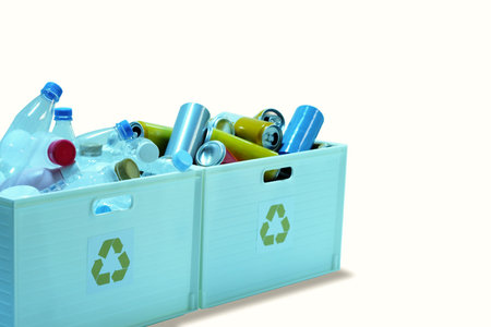 Waste plastic drinking water bottles and cans in trash bins to separate recycled materials isolated on white backgroundの写真素材