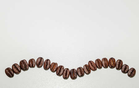 coffee in beans on a white backgroundの写真素材