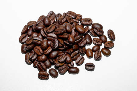 coffee in beans on a white backgroundの写真素材