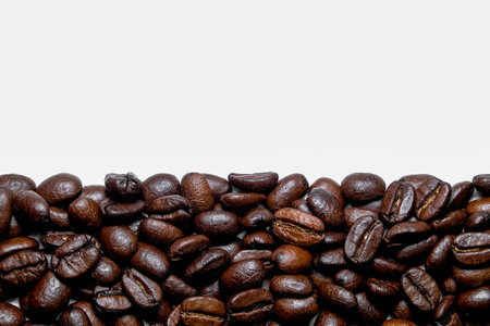 coffee in beans on a white backgroundの写真素材