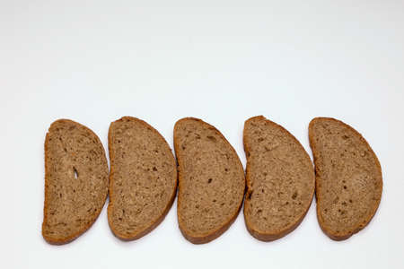 A few pieces of rye bread on a white backgroundの写真素材