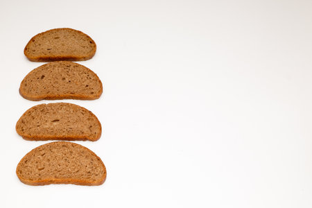 A few pieces of rye bread on a white backgroundの写真素材