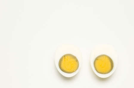 Boiled eggs on a white background. Top view. Copy space.の写真素材