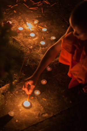 Luang Prabang, Laos - October 9: Unidentified monks light candles for the end of Buddhist Lent on October 9, 2014 in Luang Prabang, Thailand.のeditorial素材