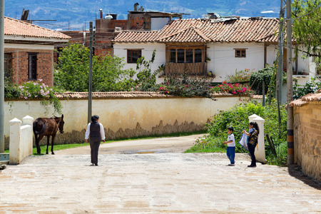 VILLA DE LEYVA, COLOMBIA - APRIL 29: Unidentified people walk down the street on April 29, 2016 in Villa de Leyva, Colombia.のeditorial素材