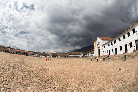 Storm clouds over the central plaza of Villa de Leyva, Colombia.のeditorial素材