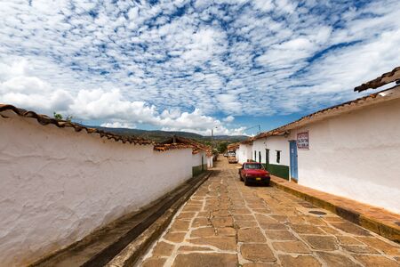 BARICHARA, COLOMBIA - MAY 5: View of vintage cars on the cobblestone streets of Barichara, Colombia on May 5, 2016.のeditorial素材