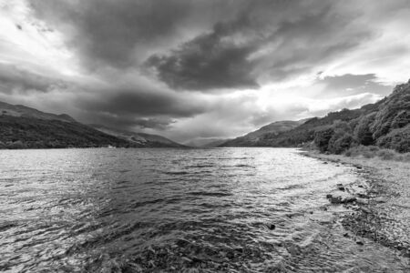 Landscape black and white view of Loch Earn in the highlands of Scotland.