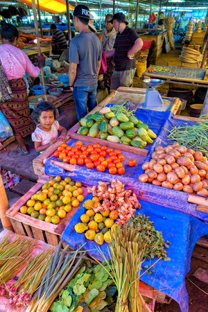 MAUMERE, INDONESIA - MAY 9: Unidentified people and vegetables at the main market in Maumere, Indonesia on May 9, 2017.のeditorial素材
