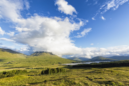 Clouds gather over Black Mount and Loch Tulla in Scotland.の写真素材