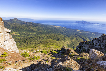 Near the summit of Mount Egon looking towards the city of Maumere and the islands of Pulau Besar and Pulau Dambila to the right.の写真素材