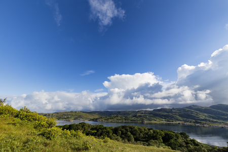 Brilliant morning blue sky and clouds over Loch Ailort, Scotland.の写真素材