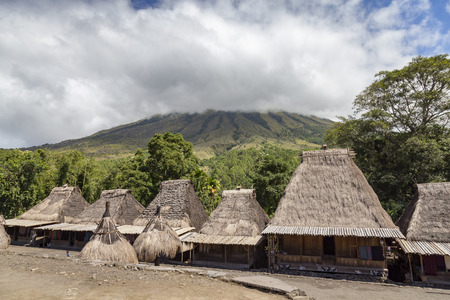 View of traditional houses and Mount Inerie in the Bena traditional village in Flores, Indonesia.の写真素材