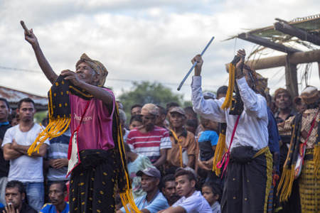 BAJAWA, INDONESIA - MAY 19: Unidentified men perform a powerful dance during a traditional boxing match near  Bajawa in East Nusa Tenggara, Indonesia on May 19, 2017.のeditorial素材