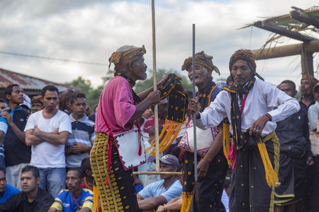 BAJAWA, INDONESIA - MAY 19: Unidentified men dance with traditional garb near  Bajawa in East Nusa Tenggara, Indonesia on May 19, 2017.のeditorial素材