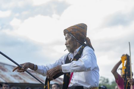 BAJAWA, INDONESIA - MAY 19: An unidentified man dances in between boxing matches near  Bajawa in East Nusa Tenggara, Indonesia on May 19, 2017.のeditorial素材