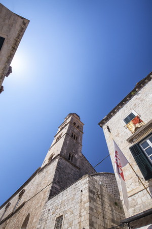A tall spire at a church in the old city of Dubrovnik, Croatia.の写真素材