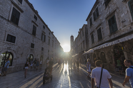 DUBROVNIK, CROATIA - AUGUST 10: Unidentified people walk in the late afternoon sun light in the old city of Dubrovnik, Croatia on August 10, 2016.のeditorial素材