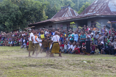 BAJAWA, INDONESIA - MAY 19: Unidentified boxers fight at a traditional boxing match near  Bajawa in East Nusa Tenggara, Indonesia on May 19, 2017.のeditorial素材