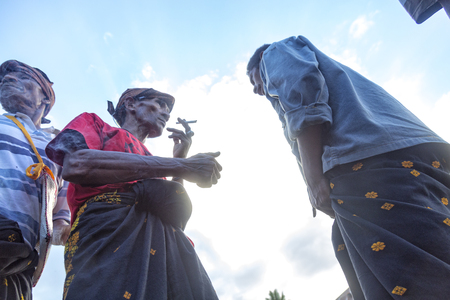 BAJAWA, INDONESIA - MAY 19: Unidentified men in traditional Sarongs near  Bajawa in East Nusa Tenggara, Indonesia on May 19, 2017.のeditorial素材