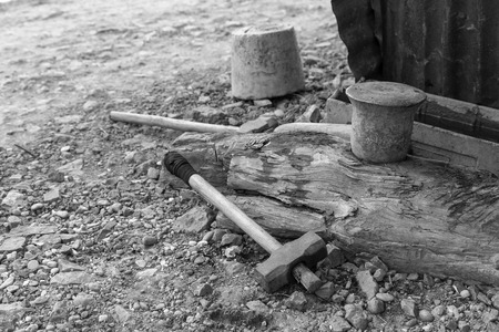 A hammer at a local village forge in Luang Prabang in black and white.のeditorial素材