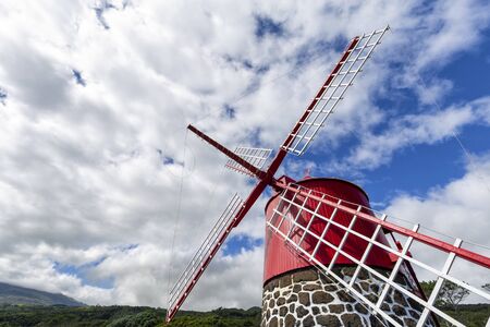A beautiful windmill near Calheta de Nesquim on Pico island in the Azores, Portugal.の写真素材