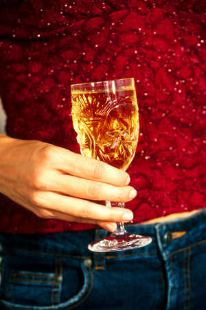 Close up of wine glass in hand
