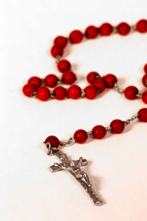 Red Rosary on a white backgroundの写真素材