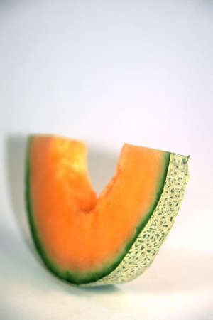  Slice of cantaloupe on a white backgroundの写真素材