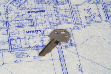 House key laying on top of blueprintsの写真素材