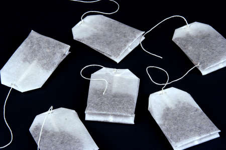 Unused tea bags on a black backgroundの写真素材